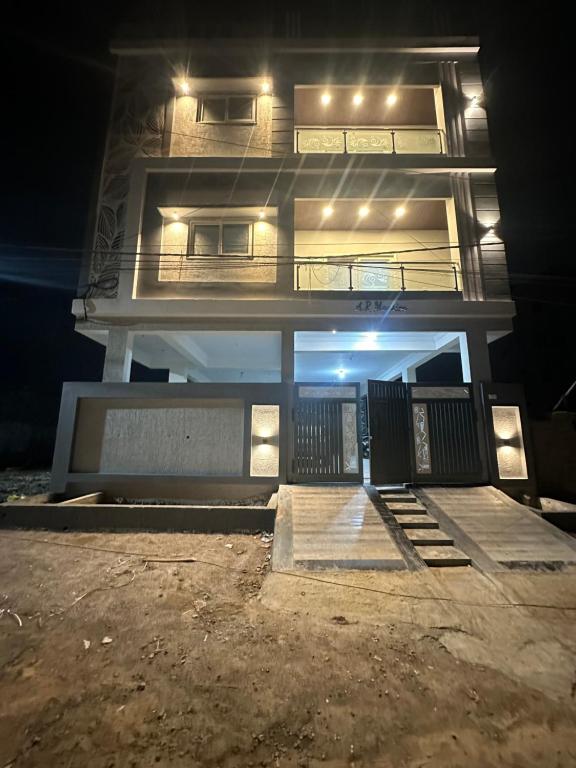 a building at night with the lights on at LOFTEL STAYS in Hyderabad