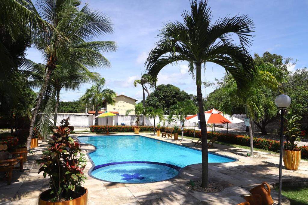 Swimmingpoolen hos eller tæt på Loft Rústico com Vista Para a Piscina