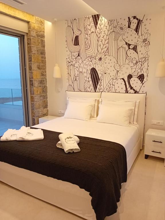 Postel nebo postele na pokoji v ubytování OLIVIA'S Villas