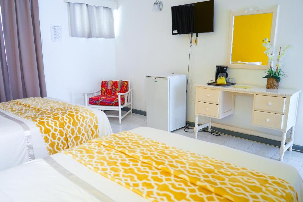 Postel nebo postele na pokoji v ubytování AYURVEDA RESORT