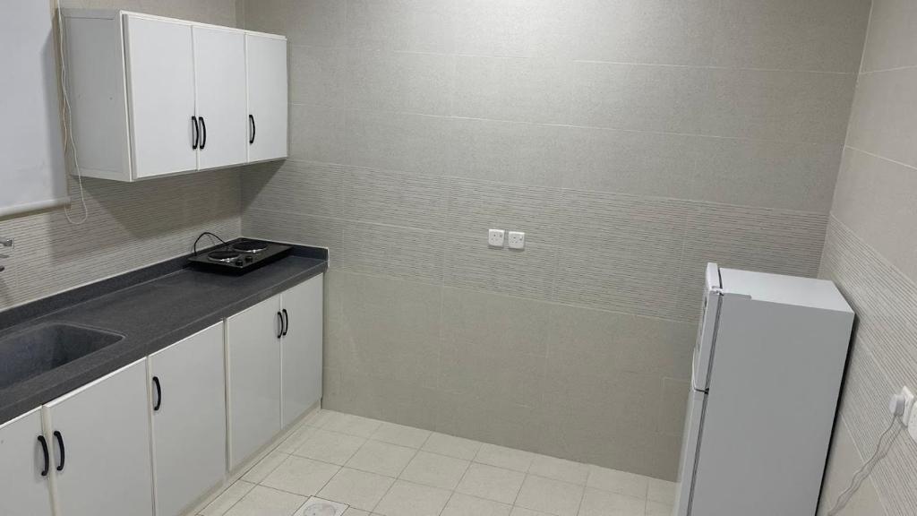 Kuchyň nebo kuchyňský kout v ubytování درر السمو للشقق الفندقية