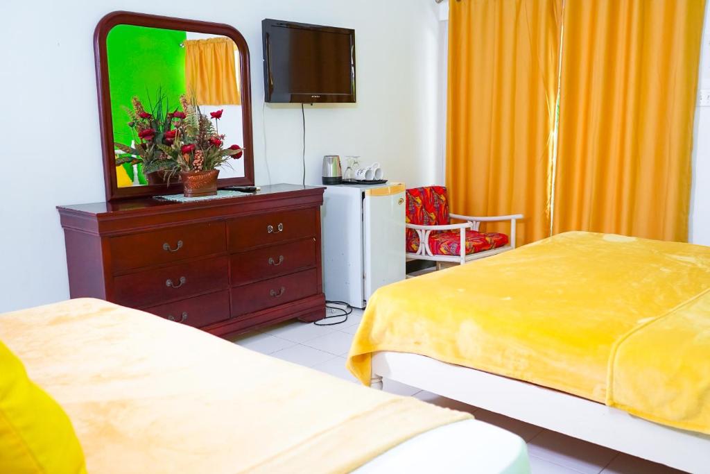 Postel nebo postele na pokoji v ubytování AYURVEDA RESORT