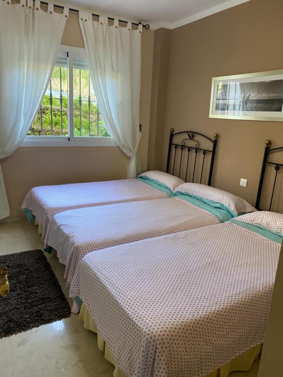 Postel nebo postele na pokoji v ubytování Marbella Elviria