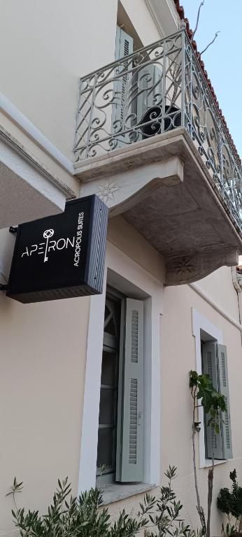 a balcony on a house with a sign on it at Apeiron Acropolis Suites in Athens