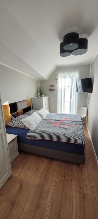 Postel nebo postele na pokoji v ubytování Apartament Mariwo