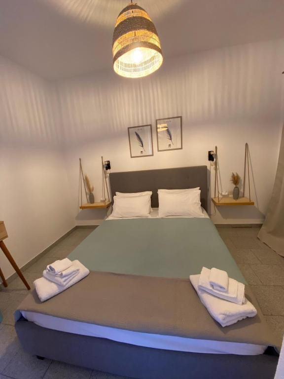 Postel nebo postele na pokoji v ubytování Karras Village