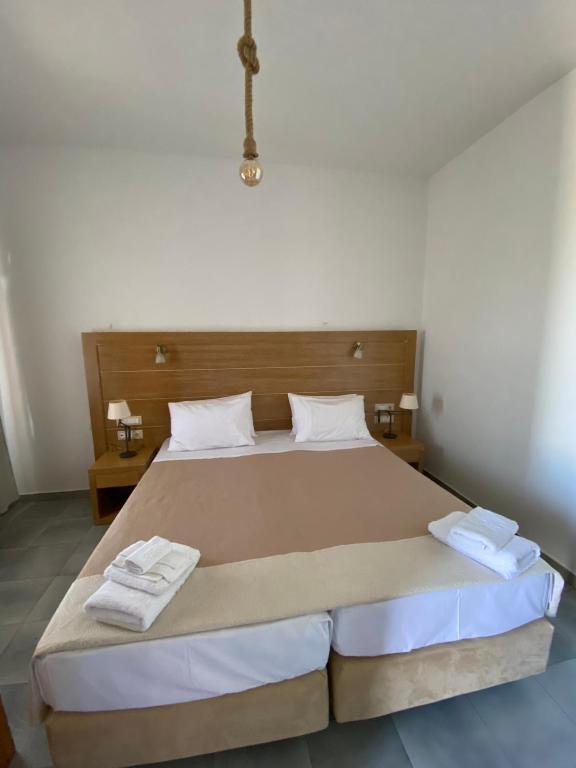 Postel nebo postele na pokoji v ubytování Karras Village