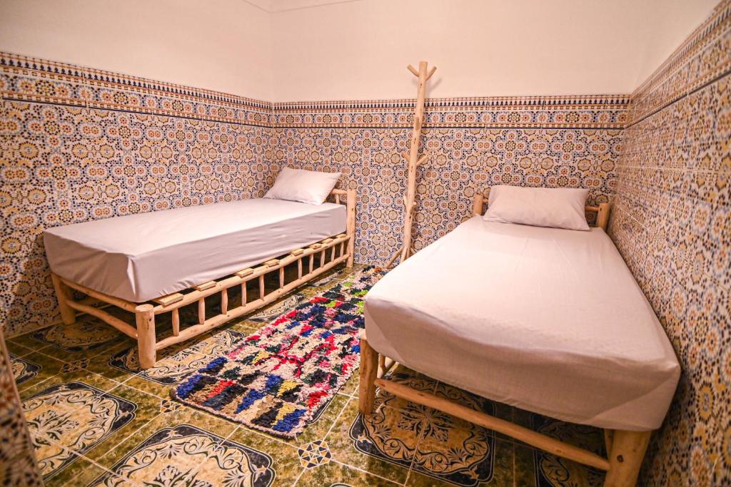 Postel nebo postele na pokoji v ubytování Oasis Medina Hostel