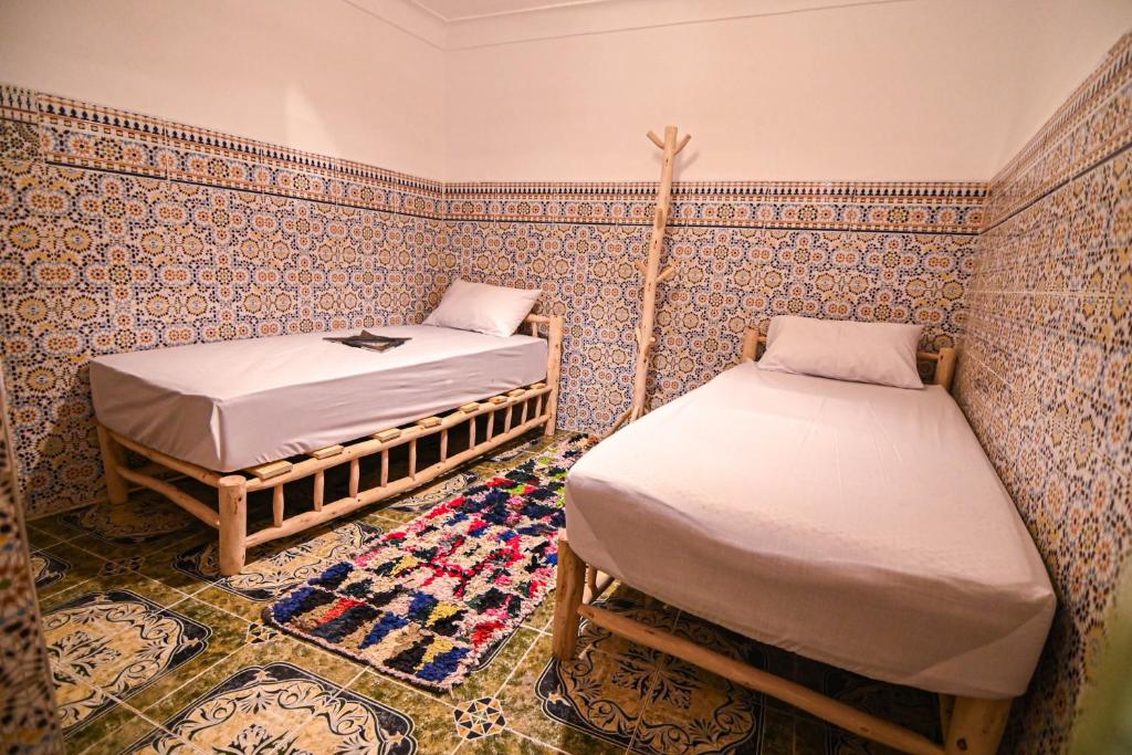Postel nebo postele na pokoji v ubytování Oasis Medina Hostel