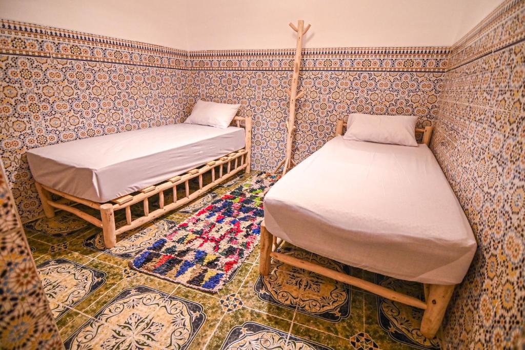 Postel nebo postele na pokoji v ubytování Oasis Medina Hostel