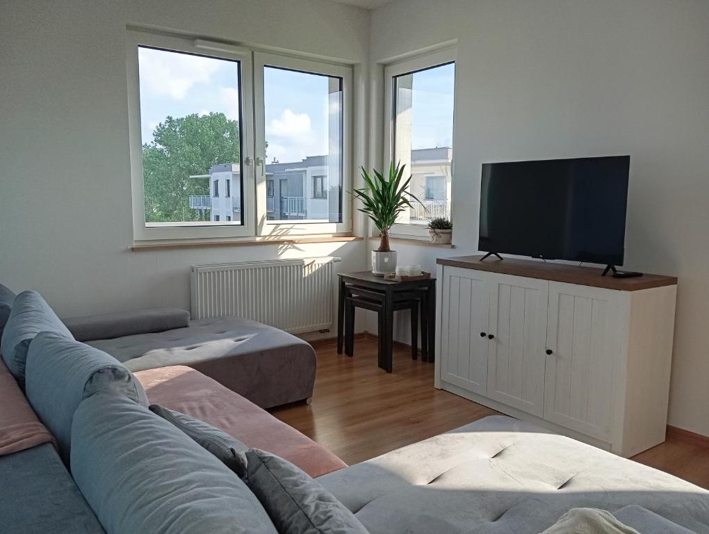 Ruang duduk di Słoneczny Apartament Uniejów