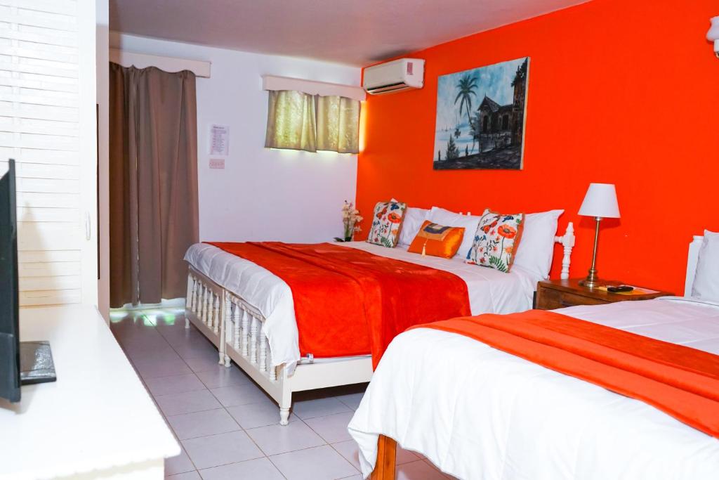 Postel nebo postele na pokoji v ubytování AYURVEDA RESORT