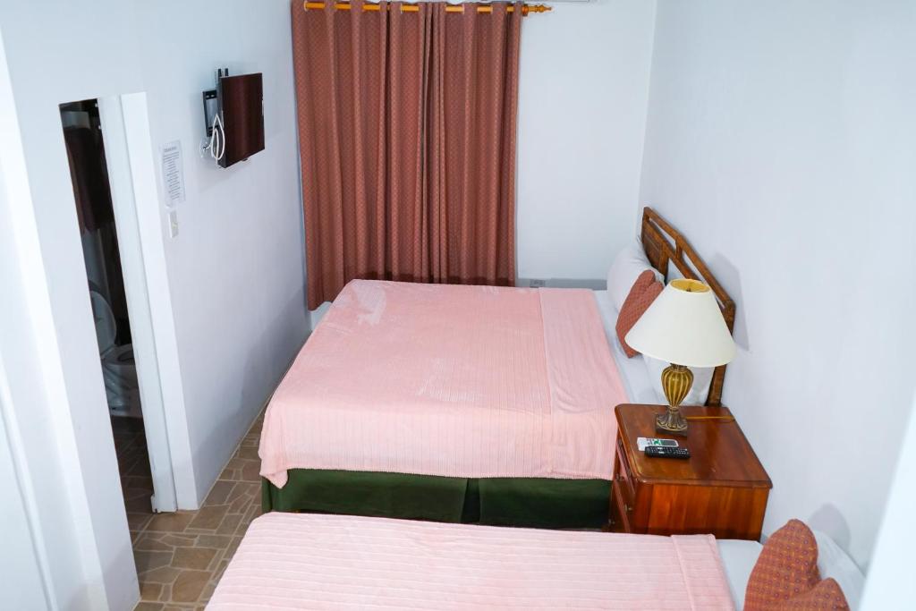 Postel nebo postele na pokoji v ubytování AYURVEDA RESORT