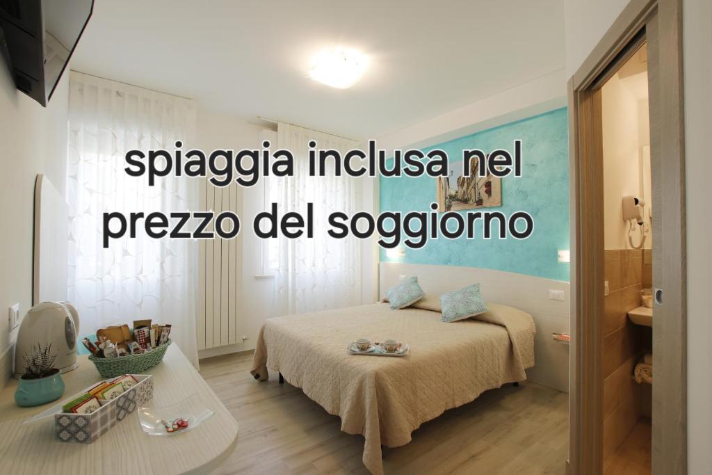 a bedroom with a bed and a table in a room at Affittacamere I Principi del Conero CIR 00041 in Numana