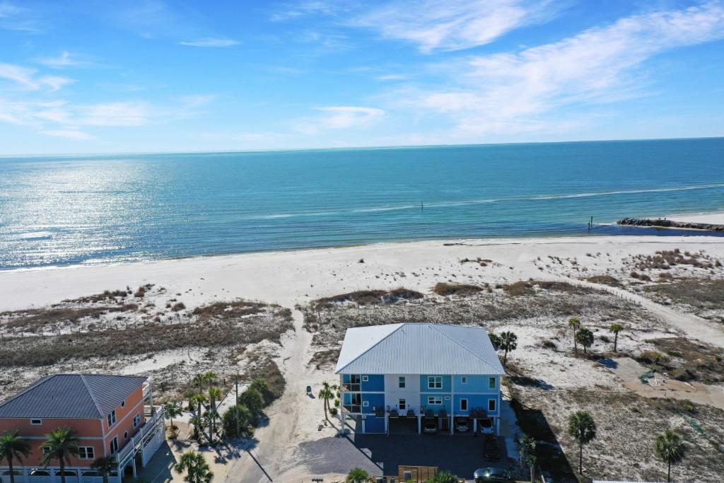 an aerial view of a house and the beach at Sea La Vie by Pristine Properties Vacation Rentals in Mexico Beach