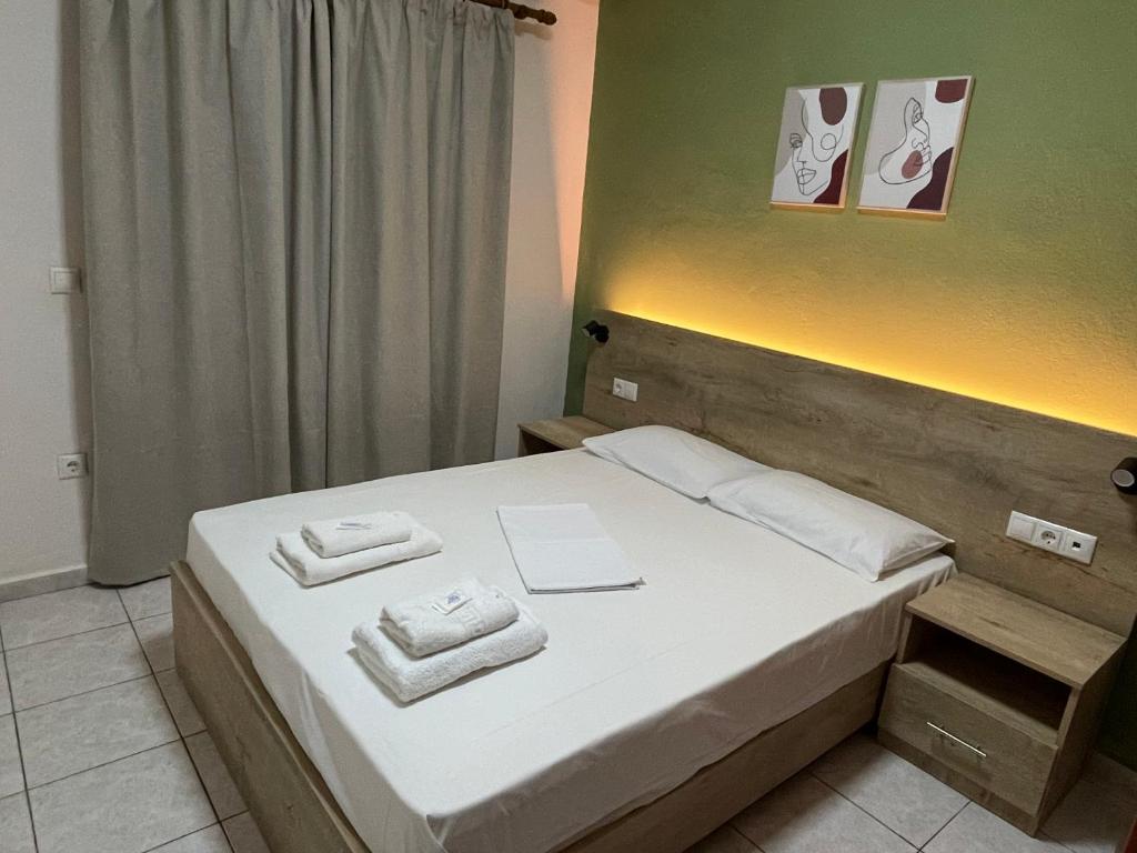 Postel nebo postele na pokoji v ubytování Hotel Evagelia