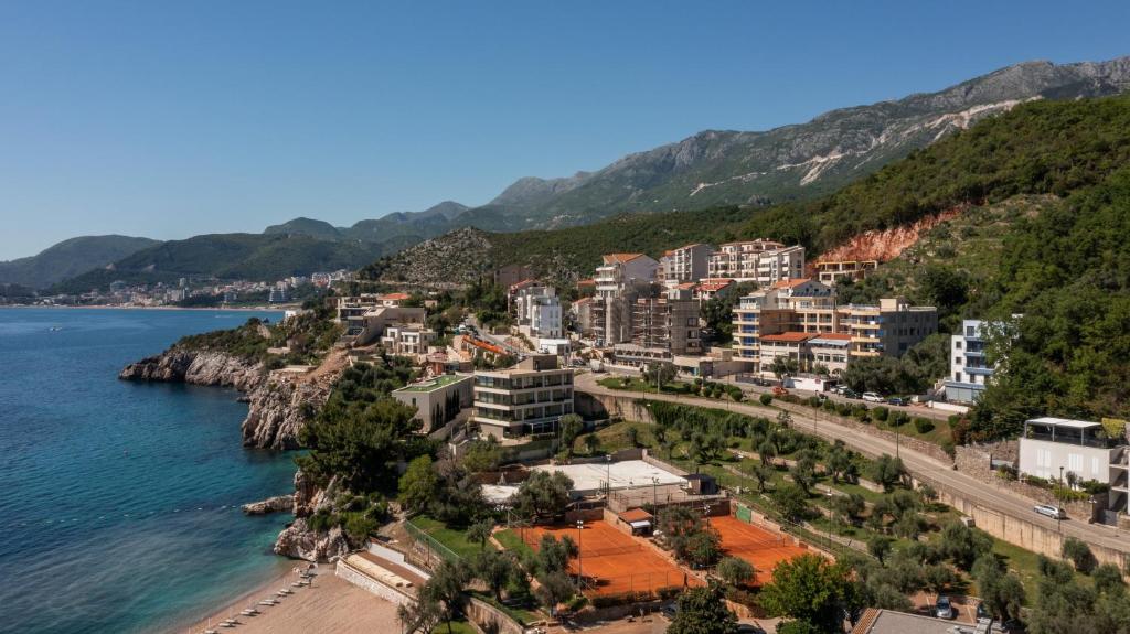 a city on the shore of a body of water at Apartments Raymond in Sveti Stefan