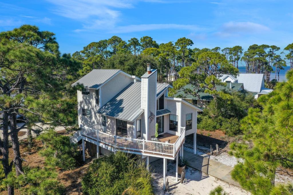 an aerial view of a house on the beach at A Swell Life by Pristine Properties Vacation Rentals in Cape San Blas