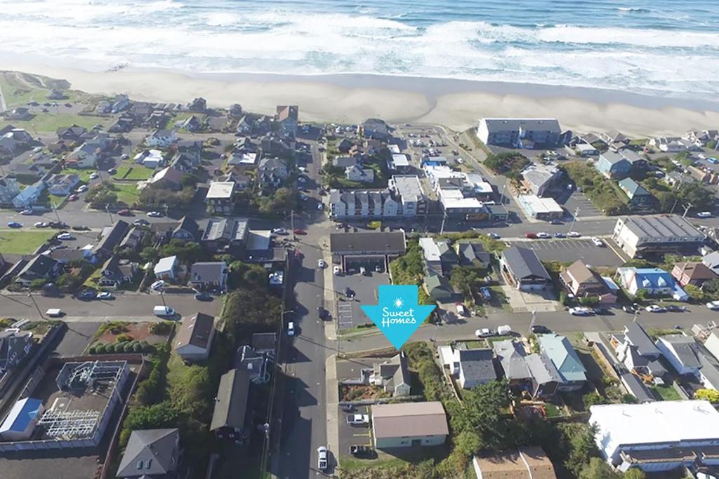 an aerial view of a suburb with a blue star at Historic Nye Creek Cottage! in Newport