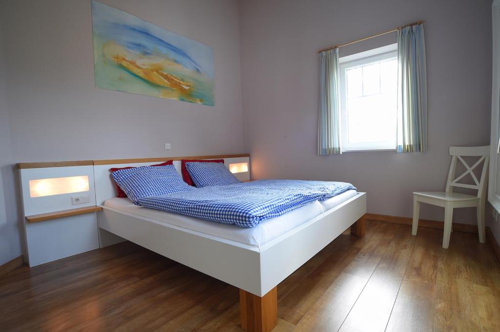 Ein Bett oder Betten in einem Zimmer der Unterkunft Hof Köhne - Haus am Reitplatz 2er