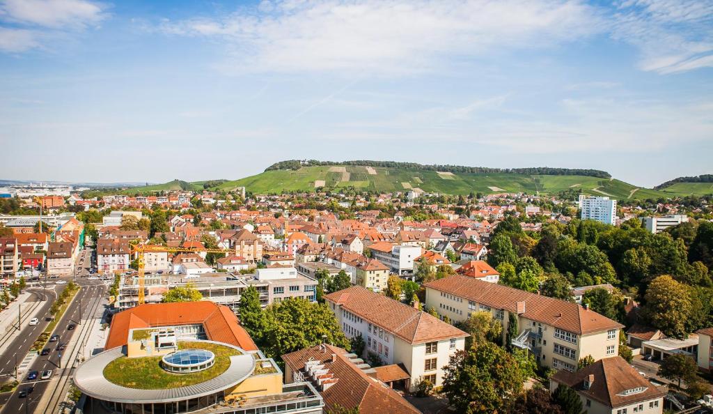 an aerial view of a city with buildings at City Hotel Heilbronn in Heilbronn