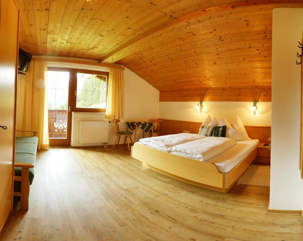 Postel nebo postele na pokoji v ubytování Doadlerhof