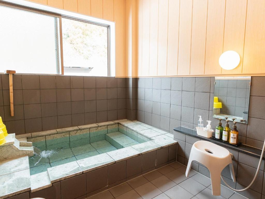 Koupelna v ubytování Nozawa Onsen Azegamikan