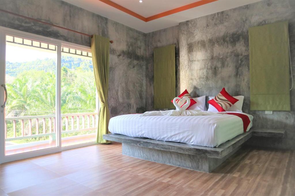 Postel nebo postele na pokoji v ubytování Tum Mai Kaew Lanta Resort