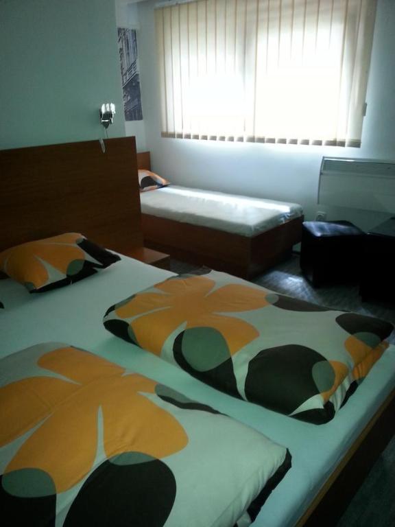 Postel nebo postele na pokoji v ubytování Prenociste Zan