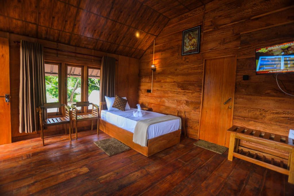 Postel nebo postele na pokoji v ubytování Lion Wood Treehouse