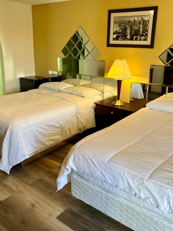 Postel nebo postele na pokoji v ubytování Royal Inn - Neptune