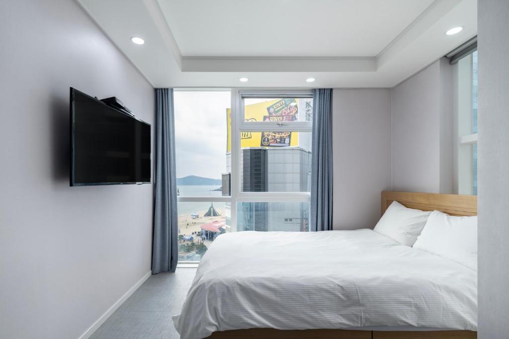 Postel nebo postele na pokoji v ubytování Elysia Boutique Hotel