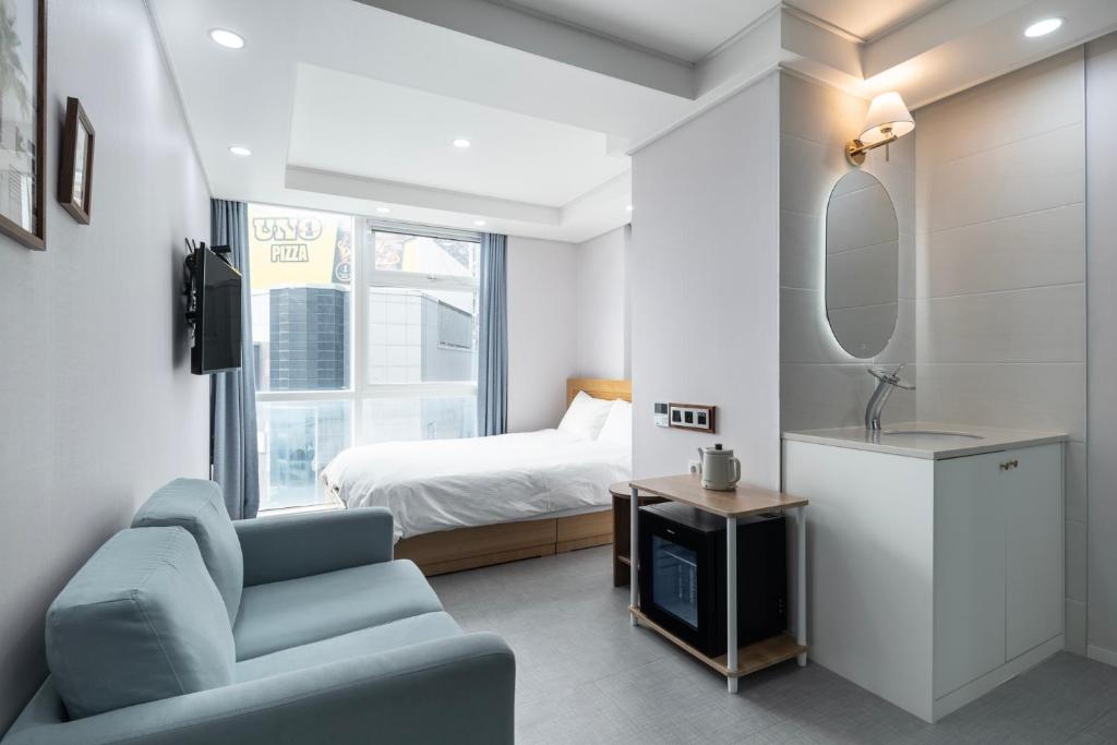 Postel nebo postele na pokoji v ubytování Elysia Boutique Hotel