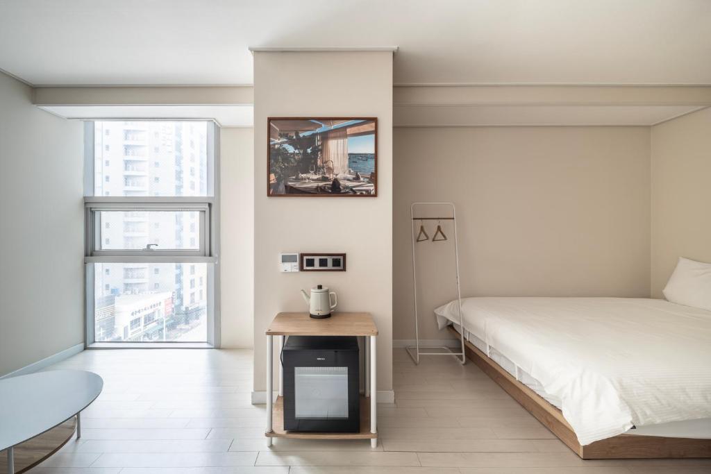 Postel nebo postele na pokoji v ubytování Elysia Boutique Hotel