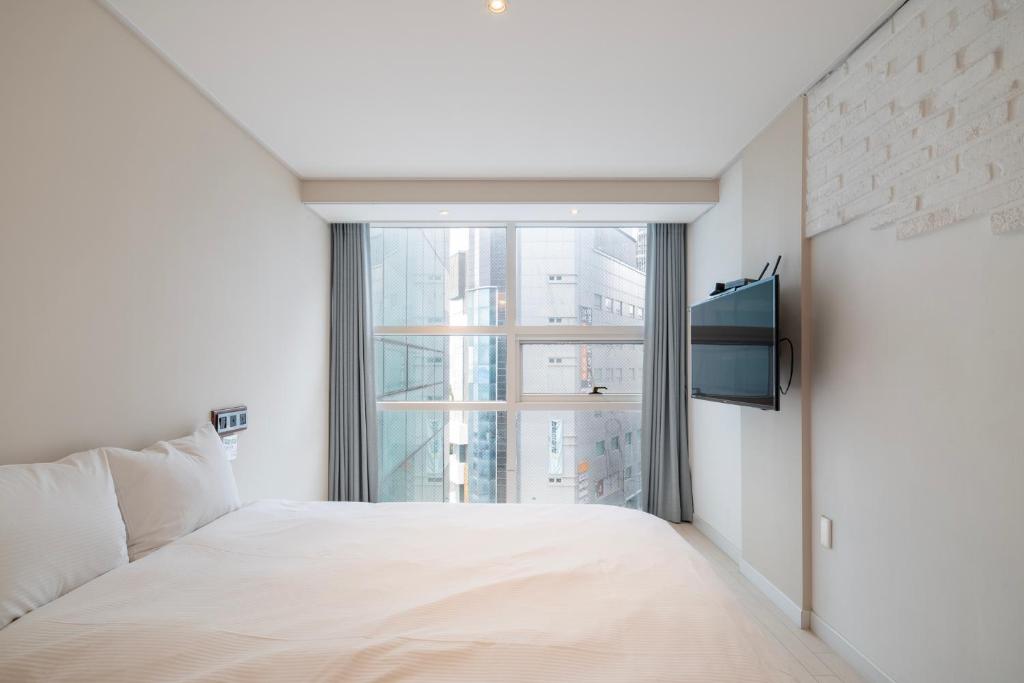 Postel nebo postele na pokoji v ubytování Elysia Boutique Hotel