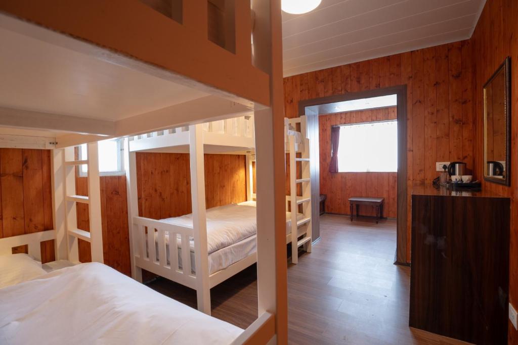 Postel nebo postele na pokoji v ubytování Poshtel, Meghma , Sandakphu
