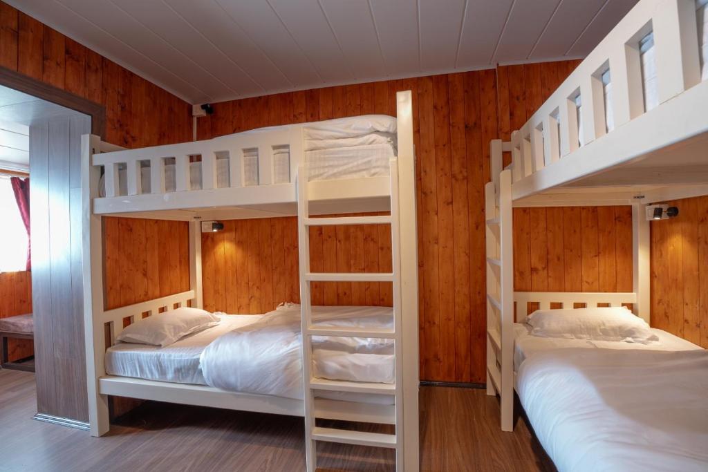 Postel nebo postele na pokoji v ubytování Poshtel, Meghma , Sandakphu