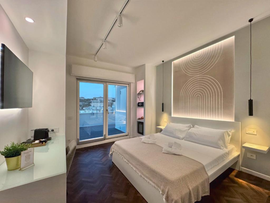 Postel nebo postele na pokoji v ubytování Mameli View Cagliari
