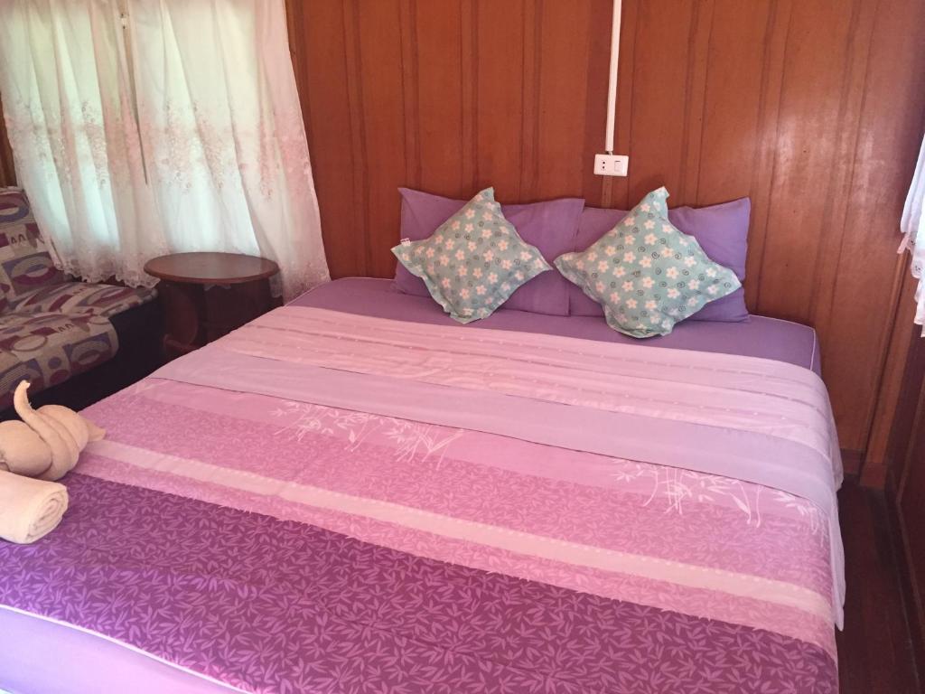 Postel nebo postele na pokoji v ubytování Sin U Rai Resort
