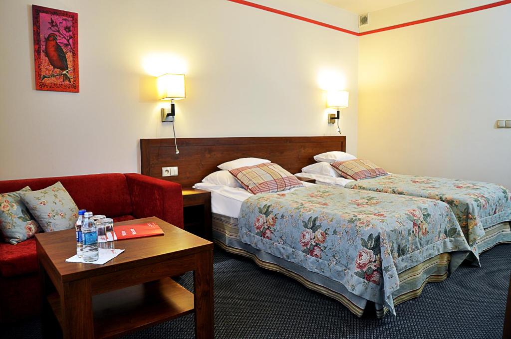 Posteľ alebo postele v izbe v ubytovaní Ahotel