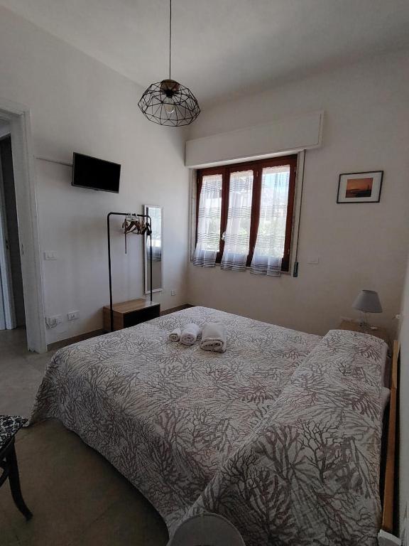 Postel nebo postele na pokoji v ubytování Villetta Scruscio ri Mare