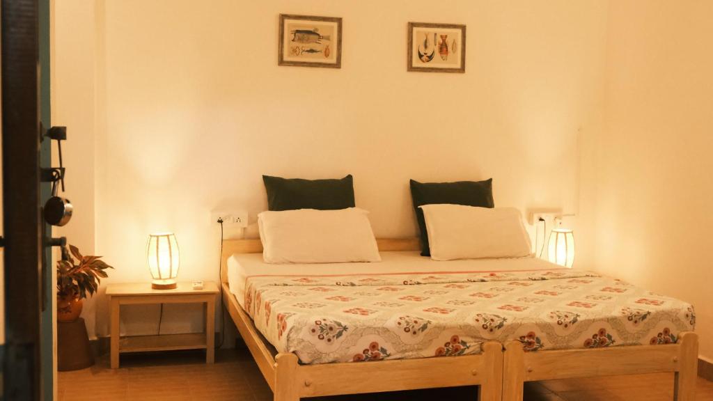 Postel nebo postele na pokoji v ubytování Coco Moon Morjim