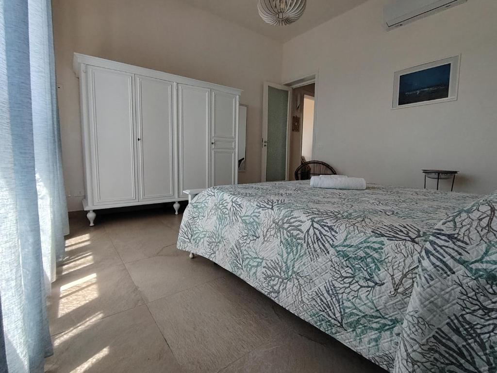 Postel nebo postele na pokoji v ubytování Villetta Scruscio ri Mare