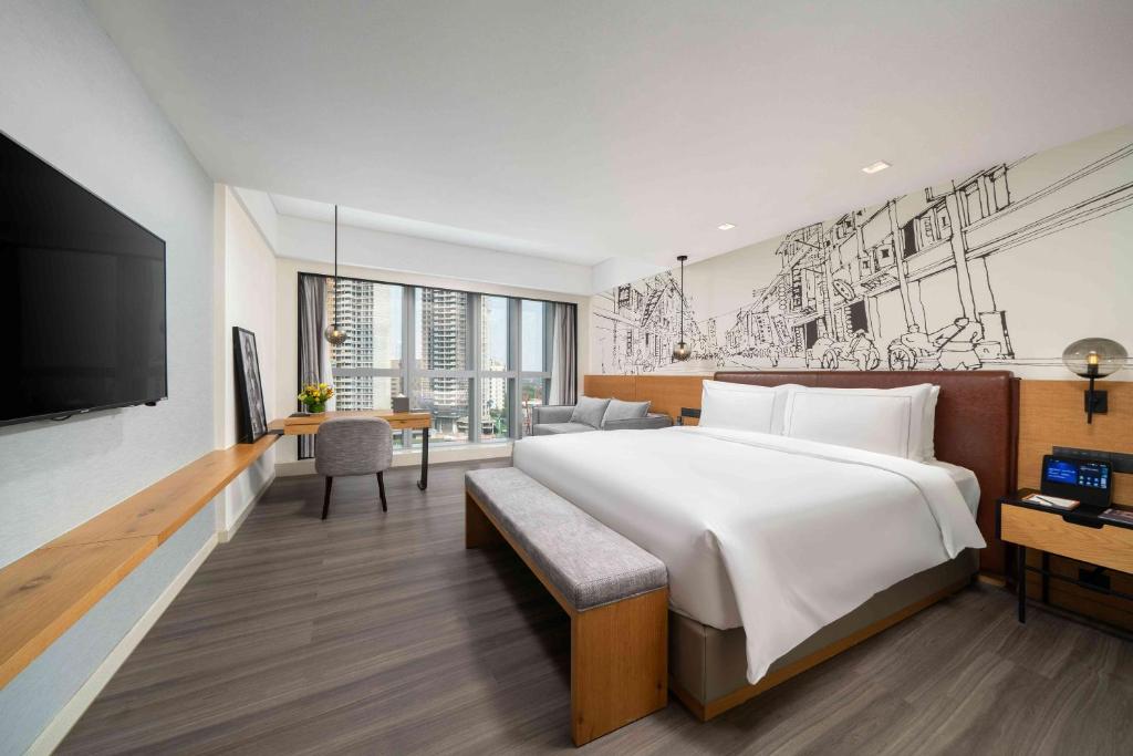 Postel nebo postele na pokoji v ubytování UrCove by Hyatt Guangzhou Canton Tower Exhibition Center-Registration Counter and Free Shuttle Bus Available during Canton Fair Period