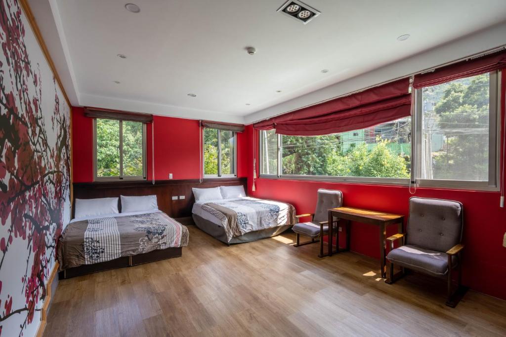 Postel nebo postele na pokoji v ubytování 溪頭老爺山莊Xitou Royal Villa