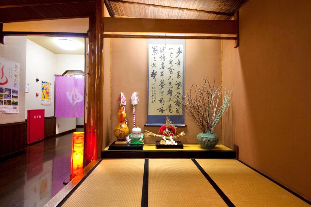 Postel nebo postele na pokoji v ubytování 日本旅館　松亀荘