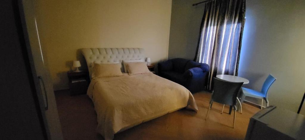 Кровать или кровати в номере Jon rooms
