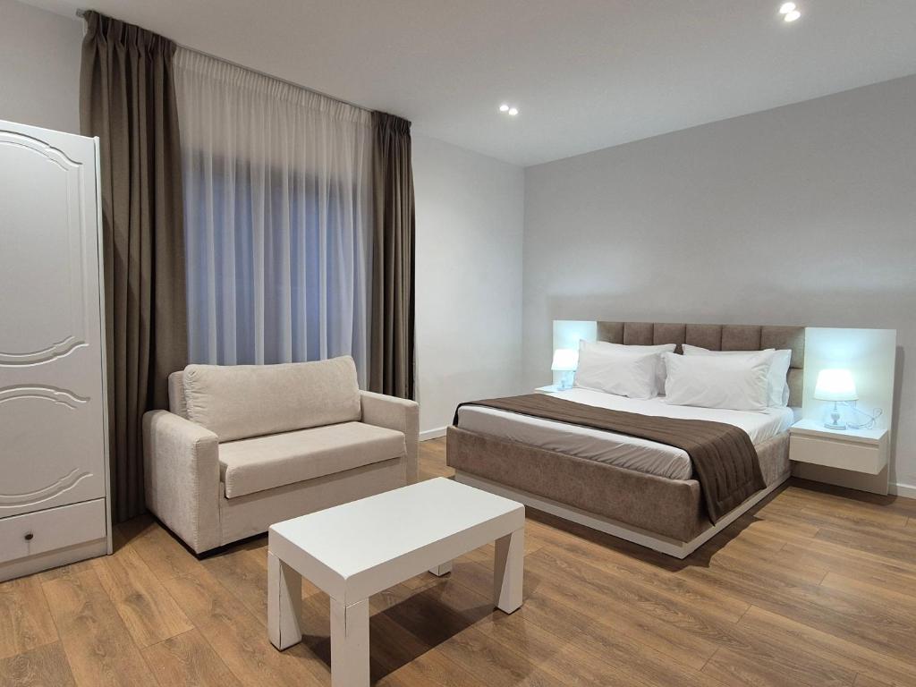 Postel nebo postele na pokoji v ubytování ORCHIDS Hotel