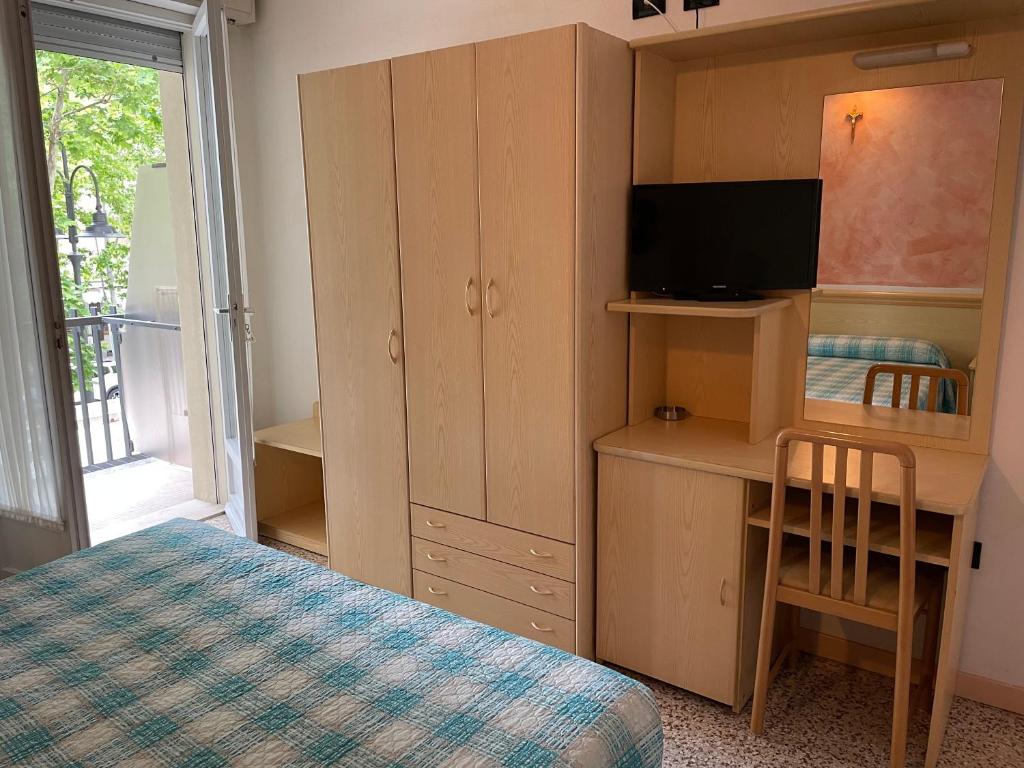Postel nebo postele na pokoji v ubytování Piccolo Hotel
