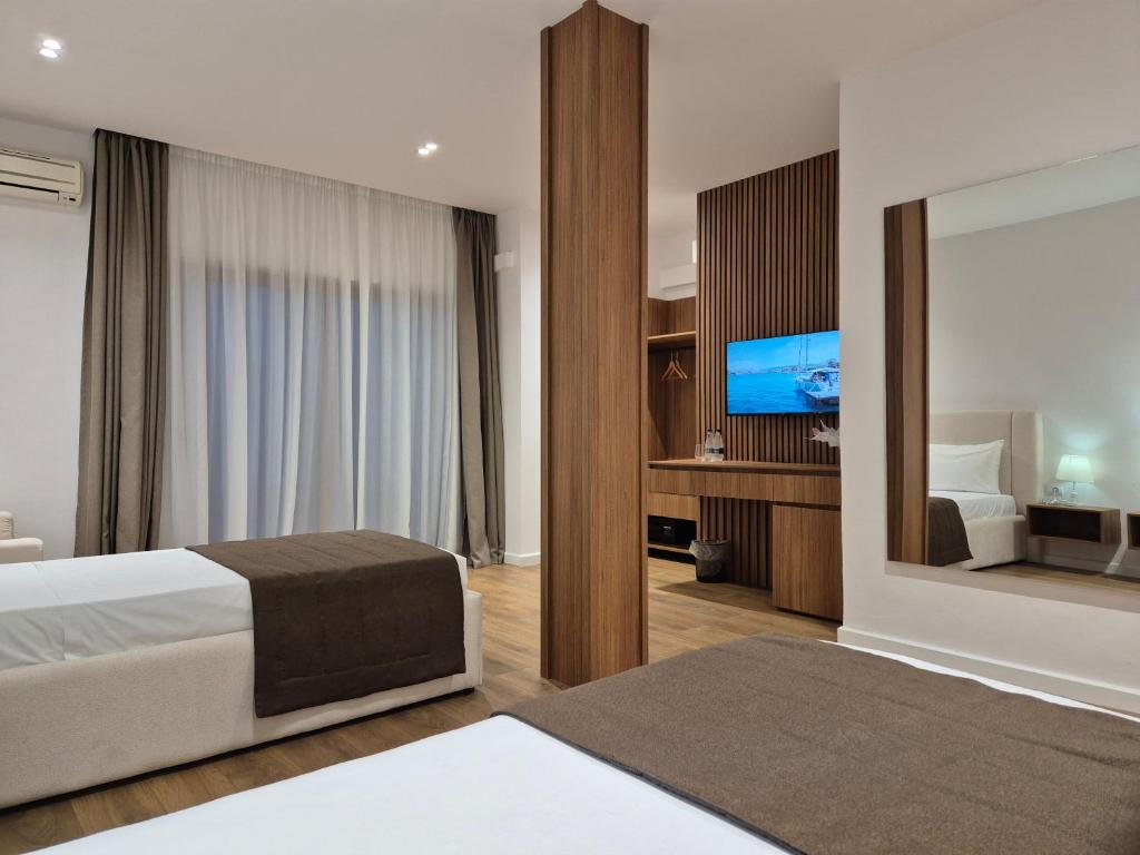 Postel nebo postele na pokoji v ubytování ORCHIDS Hotel
